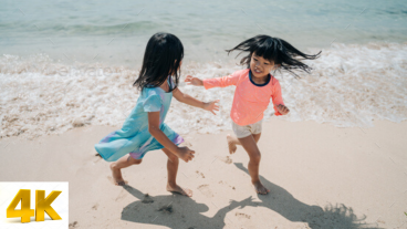 Asian Little Girl Playing On The Beach 4K Video